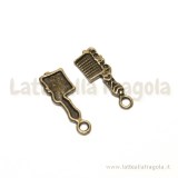 Charm pettine in metallo color bronzo 22x8mm