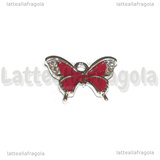 Ciondolo Farfalla con strass in metallo argentato smaltato rosso 19x15mm