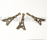 Ciondolo double-face Torre Eiffel e stella in metallo color bronzo 29x13mm