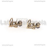 Orecchini a perno Love in metallo gold plated 13x9mm